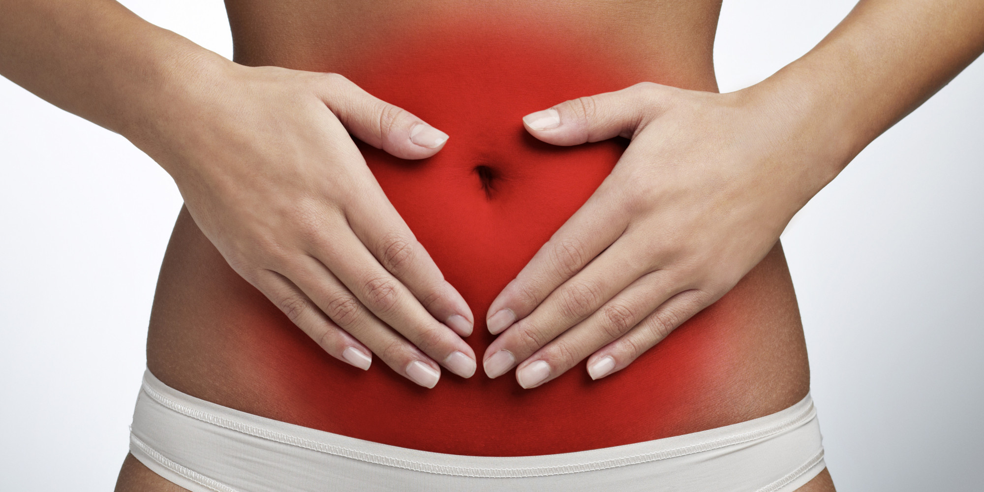 Como tratar a gastrite - Mulher segurando a barriga em estado de alerta - Instituto Digestivo